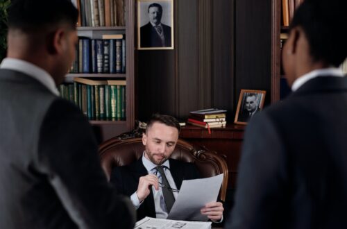 A lawyer in his office reading a contract.