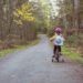 A toddler riding a bicycle