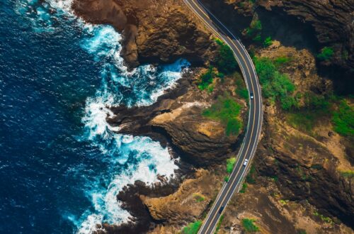 A widning road passing through the Hawaiian landscape.