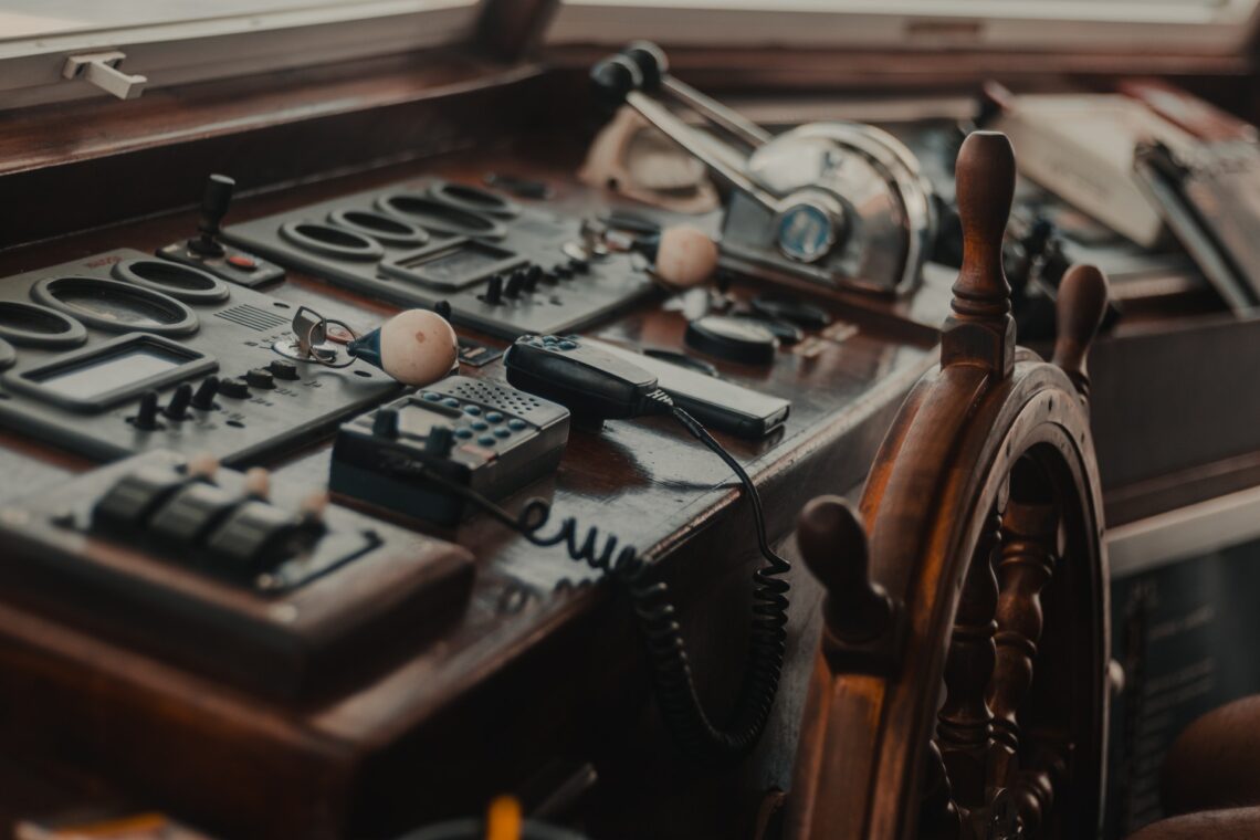 A ship's wheel and controls