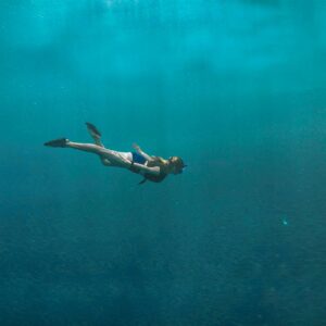 A diver in the vast pool of what seems like an endless sea.