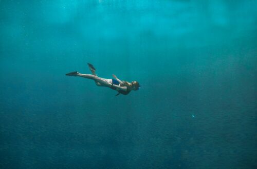 A diver in the vast pool of what seems like an endless sea.