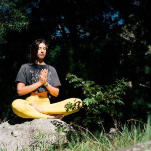 A young person meditating.