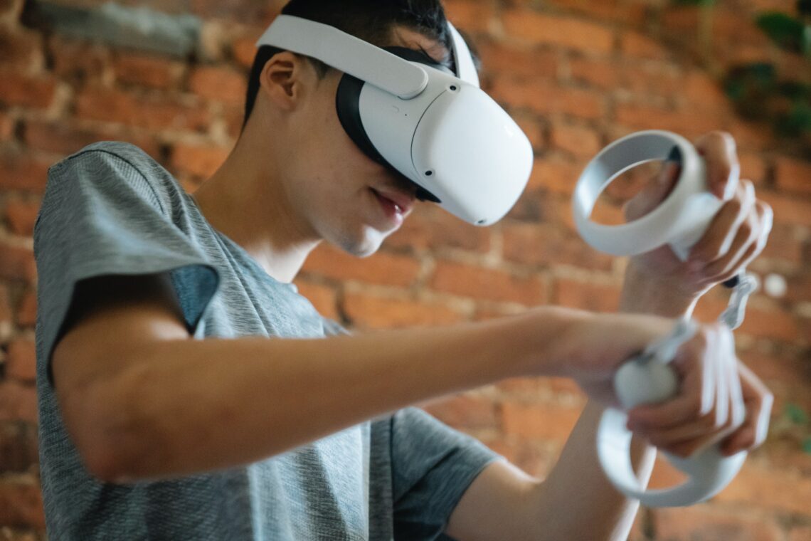 Someone using a virtual reality headset and paddles.