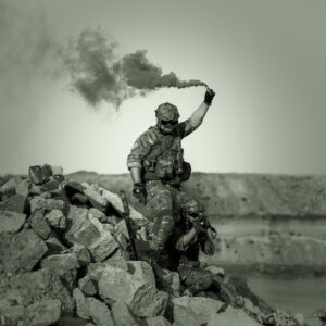 A soldier holding a signal flare
