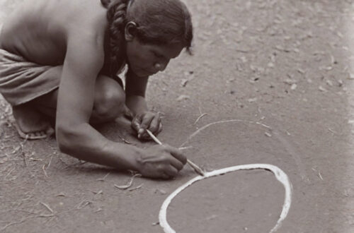 A member of the Australian First Nation transcribing a circle