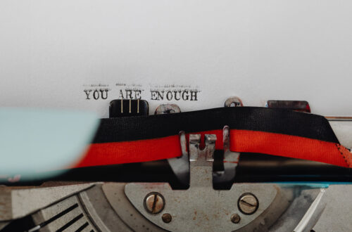 A typewriter that has written: 'You are enough'.