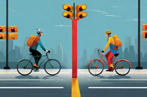 Two cyclists approaching traffic lights